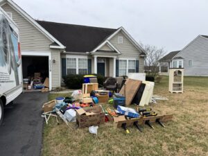 A large pile of residential junk and furniture on a driveway for removal by Insta Junk Removal & Demolition LLC in Salisbury, MD