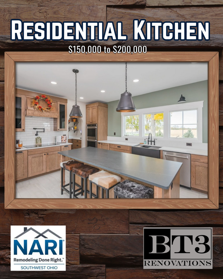 A modern residential kitchen remodel featuring a large island and wooden cabinets by BT3 Renovations in Dayton, OH.