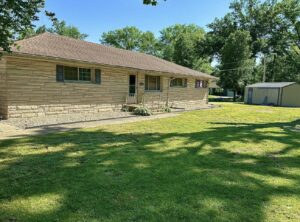 A residential property with a well-maintained lawn and shed, showcasing general property maintenance by Lankford Dirt Works LLC in Indianapolis, IN.