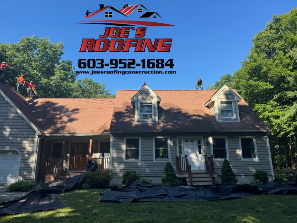 Workers performing a residential roof replacement with protective tarps on the ground for Joe's Roofing in Strongsville, OH.