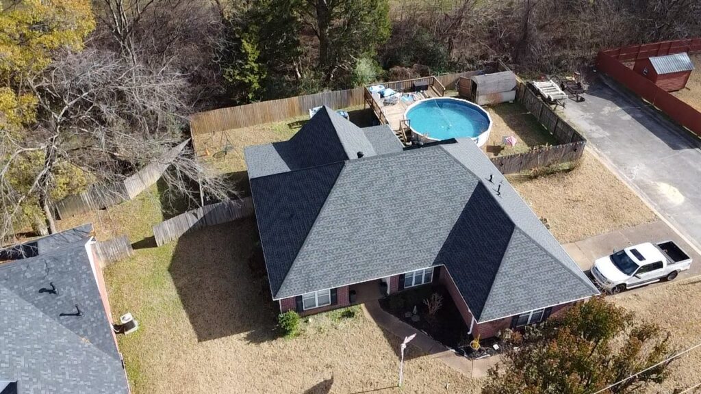 An aerial view of a residential property after a complete roof replacement by Northcross Restoration Inc in Memphis, TN.