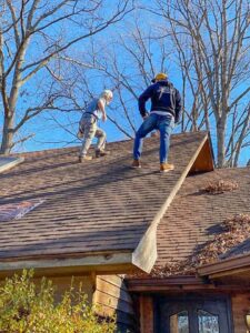 Workers performing a residential roof replacement for Southern Roofing and Renovations Clarksville in Orlando, FL.