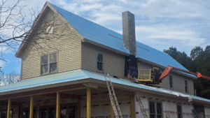 Residential house under construction with roof and siding work by Capital Construction & Contracting LLC in Raleigh, NC