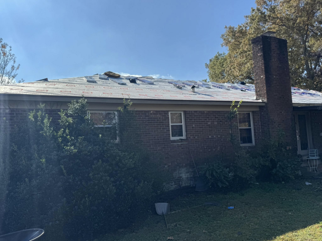 Residential roof with new underlayment being installed during a roofing project by Skyline Roofing L.L.C in Jackson, TN.