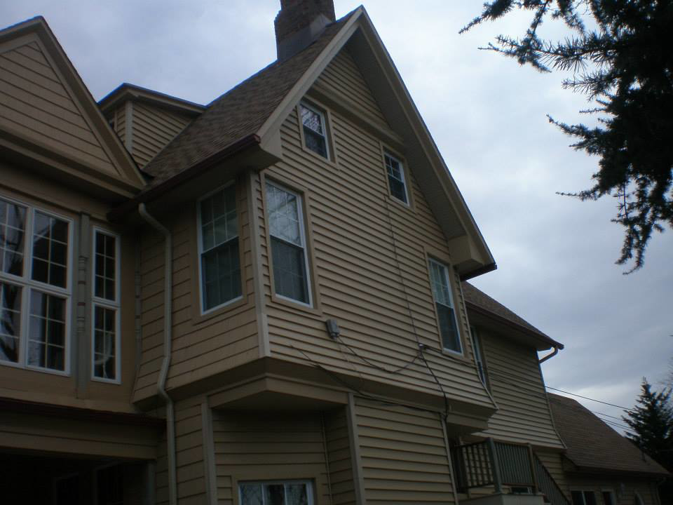 Residential house with newly installed siding and gutters by Allaico Construction in Elizabeth, NJ.