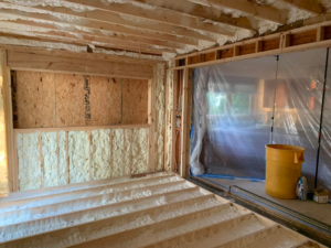 Spray foam insulation applied to walls and floor joists in a residential new construction project by Spray Foam Solutions Of Erie in Erie, PA.