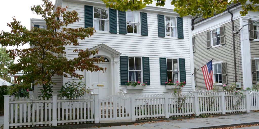 A beautiful white picket fence installed in front of a residential home by R.H. Meyer Fence Co in Cincinnati, OH.