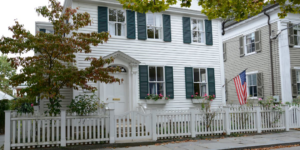 A beautiful white picket fence installed in front of a residential home by R.H. Meyer Fence Co in Cincinnati, OH.