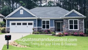 A residential home showcasing window tinting services by Augusta Sun & UV Control in Augusta, GA.
