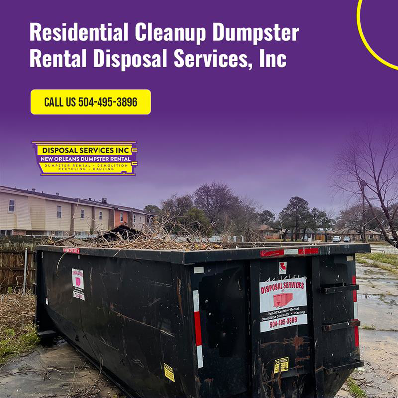 A roll-off dumpster full of yard waste for residential cleanup by Disposal Services Inc. in New Orleans, LA
