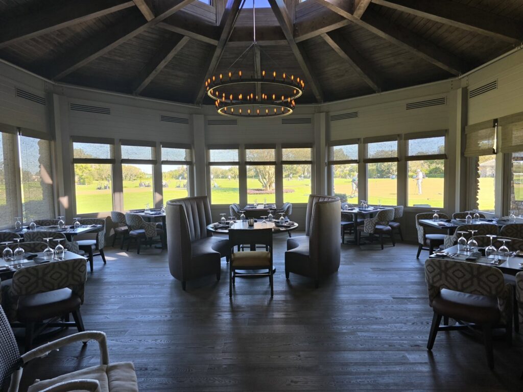 A completed restaurant dining area with a golf course view by BDM Construction, Inc in Orlando, FL