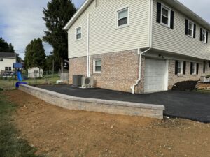 A new retaining wall and asphalt paving project completed by Angeles Contractors LLC in New Oxford, PA.