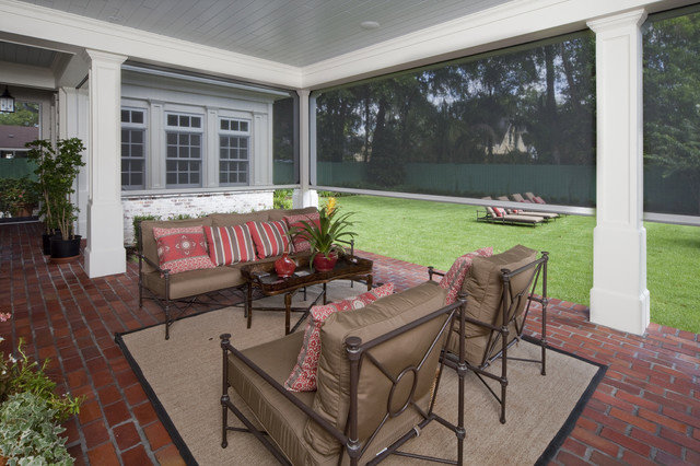 An outdoor patio with newly installed retractable screens by The Home Pros in Carson, CA.
