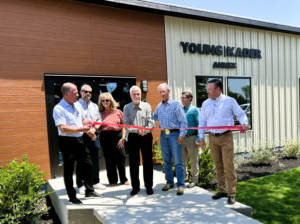 A ribbon-cutting ceremony for a new commercial building, showcasing a completed project by SEDALCO Construction Services in Fort Worth, TX.
