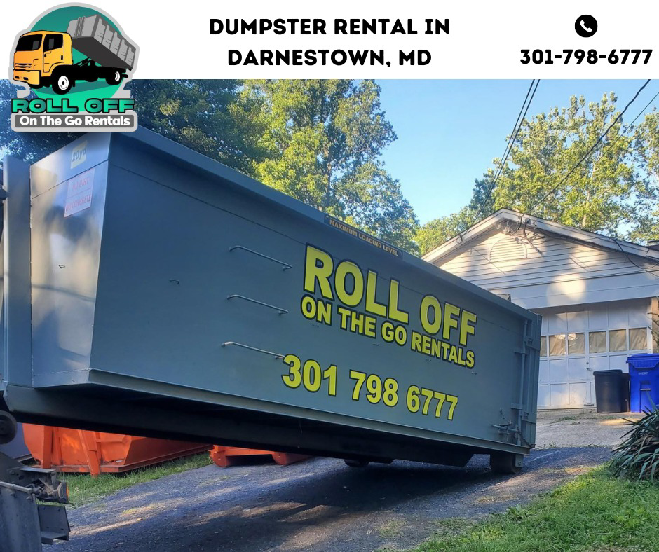 A large roll-off dumpster being placed or removed by Roll Off On the Go Rentals for junk removal in Silver Spring, MD.