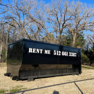 A black roll-off dumpster with 'RENT ME' text, available for rental from Team512 in Austin, TX