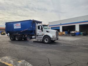 A branded roll-off dumpster truck for Nevada Recycling Henderson in Henderson, NV
