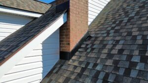 Close-up view of a well-maintained roof and chimney flashing by Innovative Roofing & Siding Inc in Knoxville, TN.