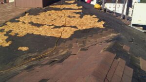 Roof decking exposed during shingle replacement by Villalobos Remodeling & Construction in El Paso, TX