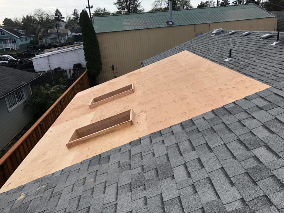 Roof decking installation in progress with openings for skylights by All in One Remodeling Services LLC in East Sandwich, MA