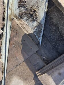 Close-up of roof flashing and tiles during repair or maintenance by Peraza Handyman Services Llc in Bakersfield, CA.