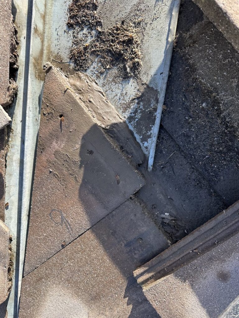 Close-up of roof flashing and tiles during repair or maintenance by Peraza Handyman Services Llc in Bakersfield, CA.
