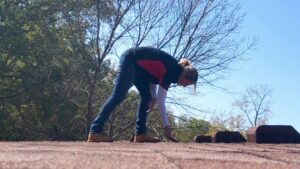 A professional conducting a thorough roof inspection service by Gwen Co in St. Louis, MO.