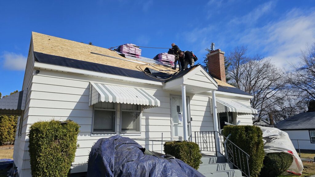 Roof installation in progress with underlayment and shingles by Proline Roofing in Shipshewana, IN.