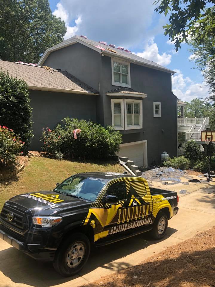 A roof renovation work site with a Southern Roofing and Renovations Clarksville truck parked outside in Orlando, FL.