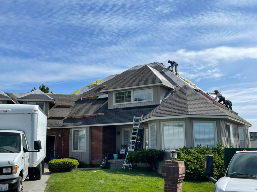 Workers performing roof repair and installation services for A1 Construction of Yakima in Yakima, WA