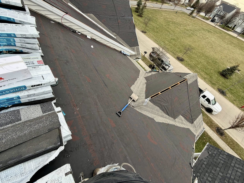 Roof repair in progress with underlayment and new shingles by Darby Builders in Columbus, OH.