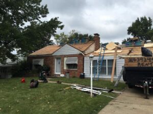 A residential roof replacement project in progress with old shingles removed by Gwen Co in St. Louis, MO.