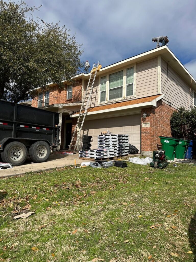 A residential roof replacement in progress with materials and a dumpster on site by Riker Home Services in Plano, TX
