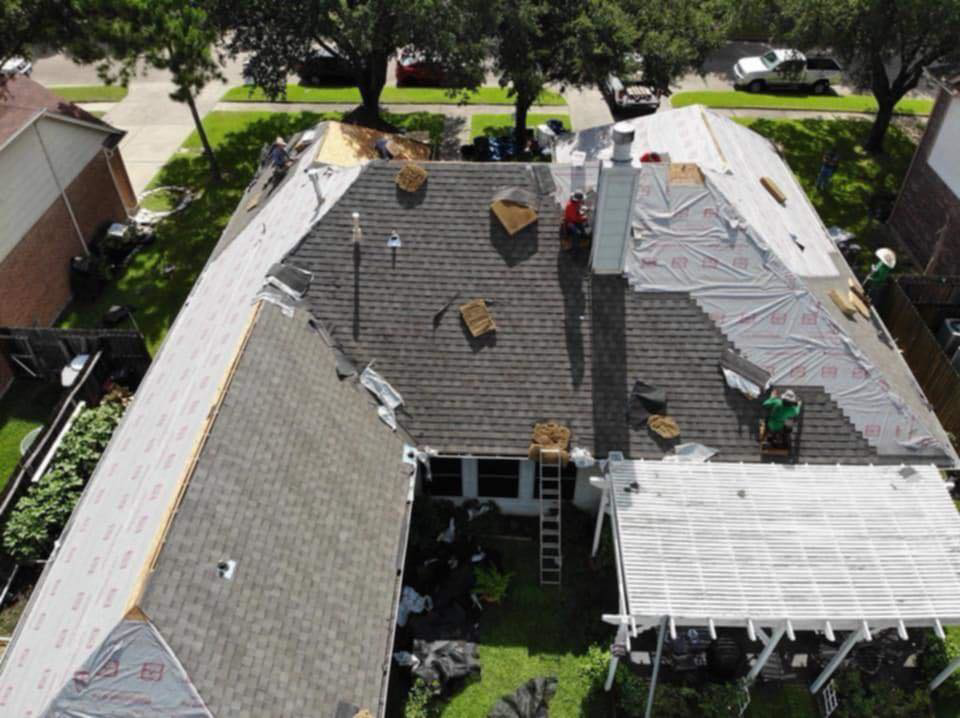 Aerial view of a residential roof undergoing replacement or installation by KDB Roofing & Construction in Tulsa, OK