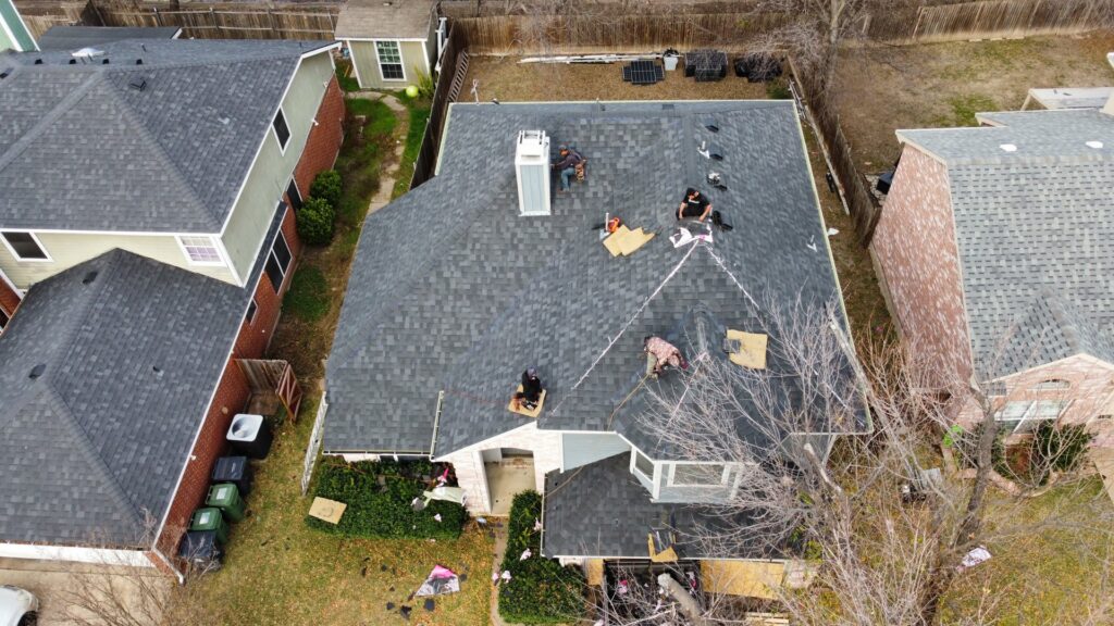 Aerial view of a roof tear-off and underlayment installation by Canek Construction LLC in Fort Worth, TX