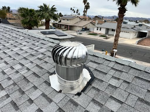 A newly installed roof turbine vent on a shingle roof by Vegas Valley Remodeling/Handy-Man Services in Las Vegas, NV.