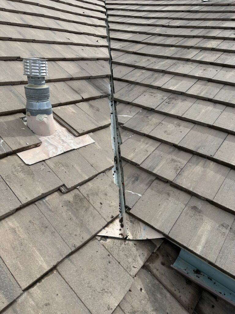 A roof valley with tiles and metal flashing installed by Peraza Handyman Services Llc in Bakersfield, CA.