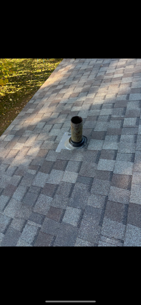 Close-up of a newly installed or repaired roof vent pipe on asphalt shingles by AK Overhead Door & Handyman Services in Wetumpka, AL.