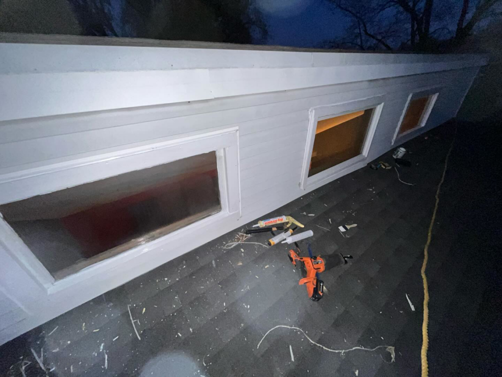 Tools and materials on a roof during window installation by McDonald Residential Contracting in Ames, IA.