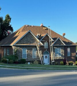A roofer hammering shingles during a roof installation by Southern Roofing and Renovations Clarksville in Orlando, FL.