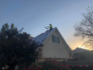 A roofer working on a residential roof renovation project by Remodeling by Simplified Solutions in Saint Charles, MO