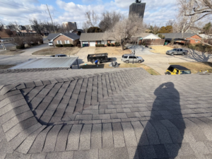 Roofing crew and equipment during a renovation project by Complete Renovations in Bethany, OK