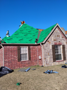 A roofing crew installing new shingles over green underlayment for Right Choice Roofing Oklahoma in Collinsville, OK.