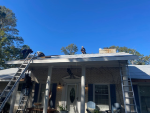 Workers installing a new roof on a house, a handyman job by Consolidated Roofing Systems, Inc. in Cary, NC