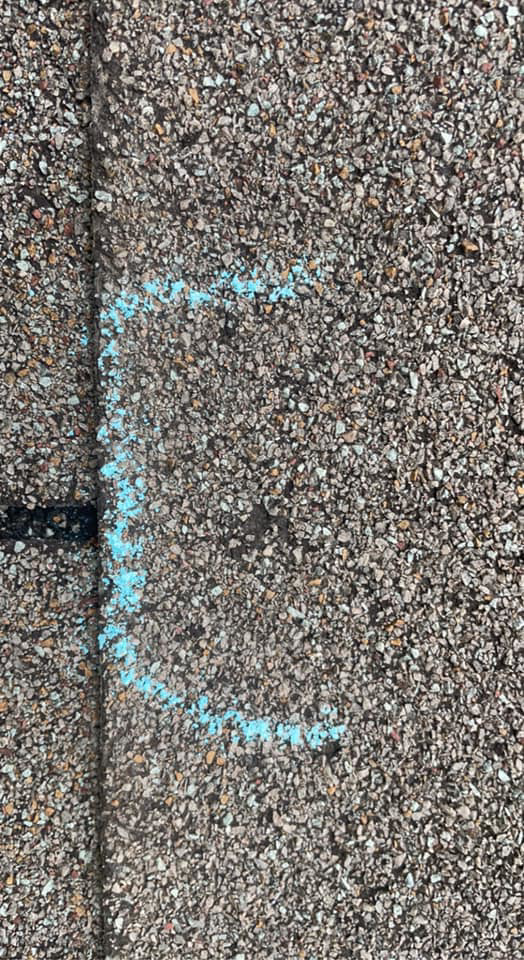 An asphalt shingle roof with a blue chalk mark, part of a repair assessment by Ramirez Roofing and Repair, LLC in Kansas City, MO.