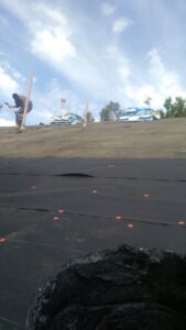 Roofing workers installing shingles on a house roof for Villalobos Remodeling & Construction in El Paso, TX