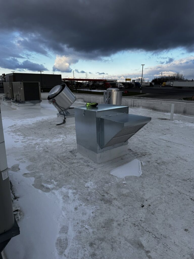 Commercial kitchen exhaust fans and ventilation units installed on a rooftop by ProKitchen Solutions in Russiaville, IN