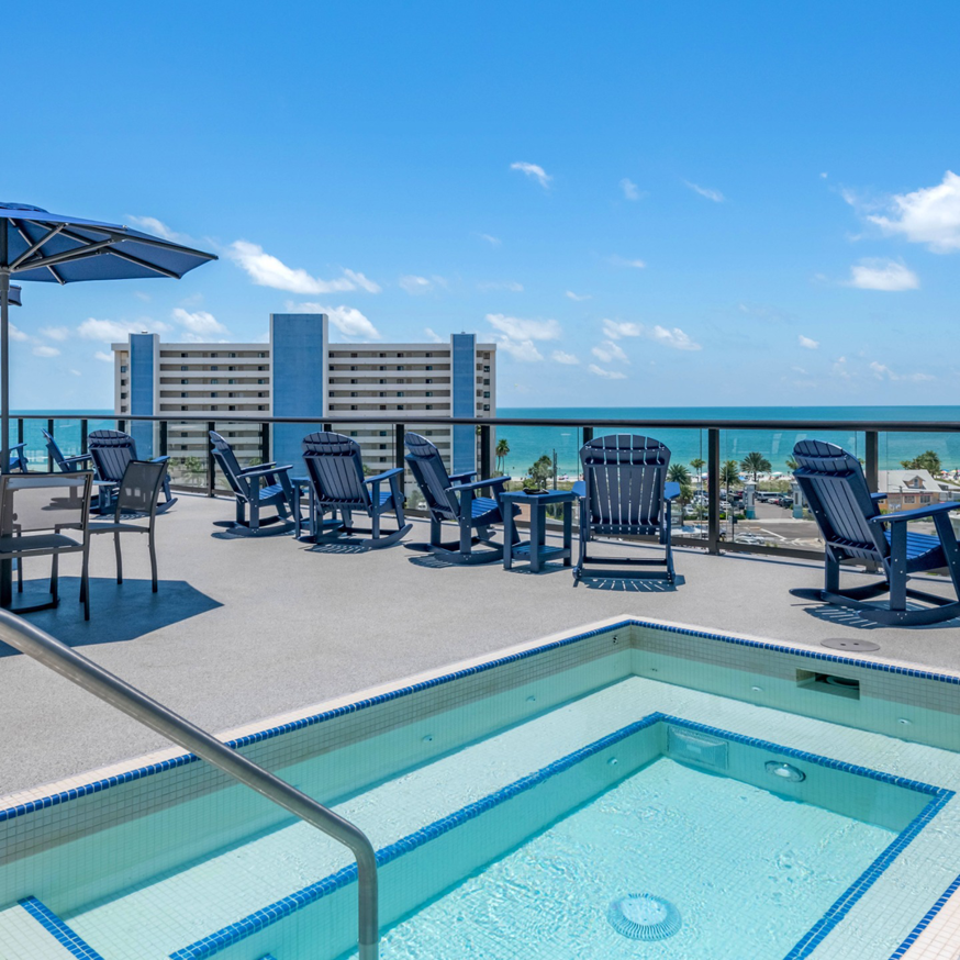 Rooftop hot tub and lounge area with an ocean view, a completed project by LEMA Construction, Inc. in Saint Petersburg, FL.