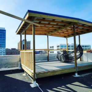 Rooftop pavilion under construction with wooden framing, showcasing general contractor work by Tundo Construction & Design Corp in Buffalo, NY.