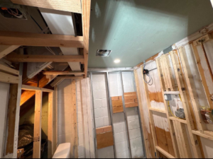 An interior room under construction with exposed framing and partial drywall by Clearview Home Remodeling in Parkville, MD.